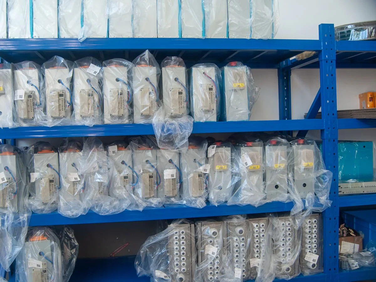 Elevator components stored on shelves at the BST Express factory